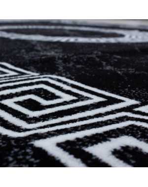 Modern design vloerkleed met zwart-witte randversiering van optisch marmer.