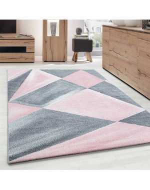 Modern design vloerkleed met geometrische patronen, kortpolig, grijs, roze en wit gespikkeld.