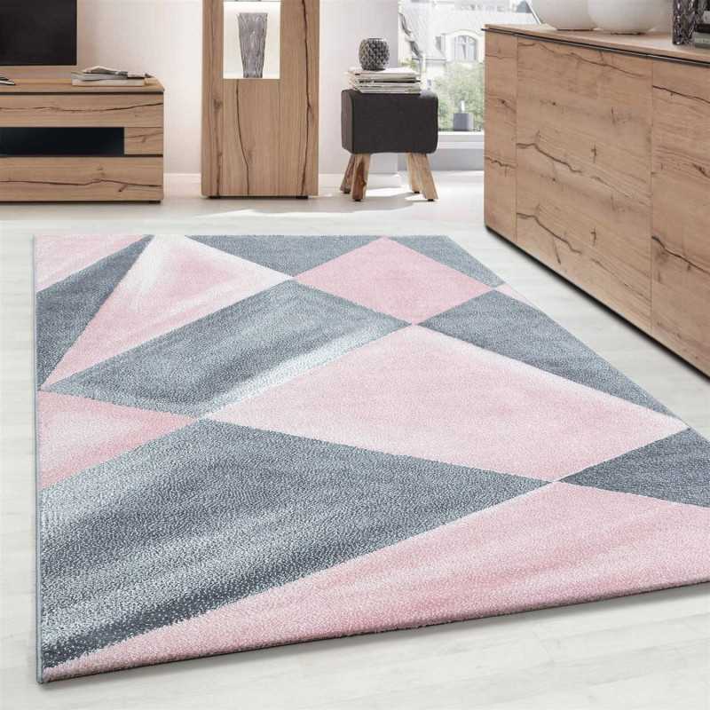 Modern design vloerkleed met geometrische patronen, kortpolig, grijs, roze en wit gespikkeld.