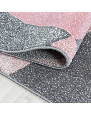 Modern design vloerkleed met geometrische patronen, kortpolig, grijs, roze en wit gespikkeld.