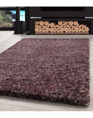 Hoogwaardig, pluizig woonkamerkleed in roze, paars, taupe, crème en gespikkelde uitvoering.