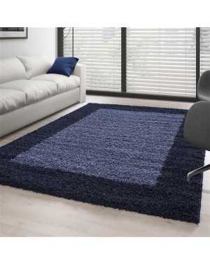 Hoogpolig vloerkleed met designrand, verkrijgbaar in verschillende kleuren en maten.